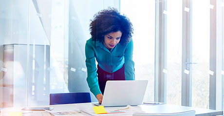 Woman working in modern glass office