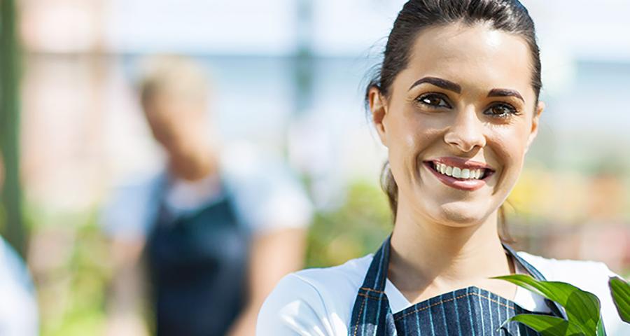 Woman in garden smiling at the camera