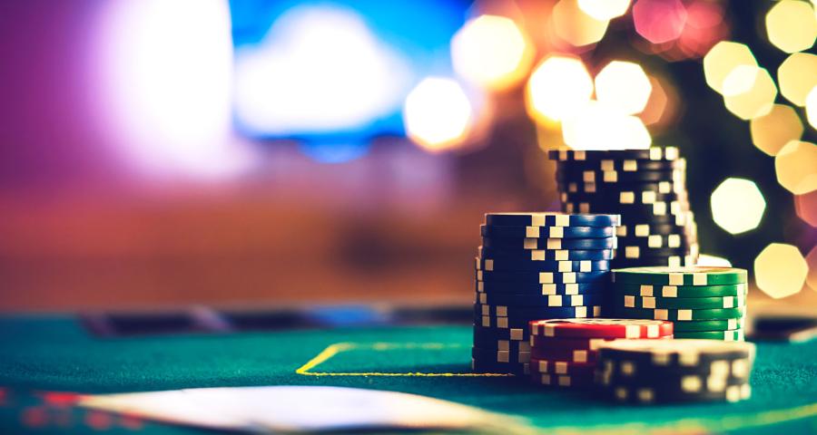 View of casino chips on green felt